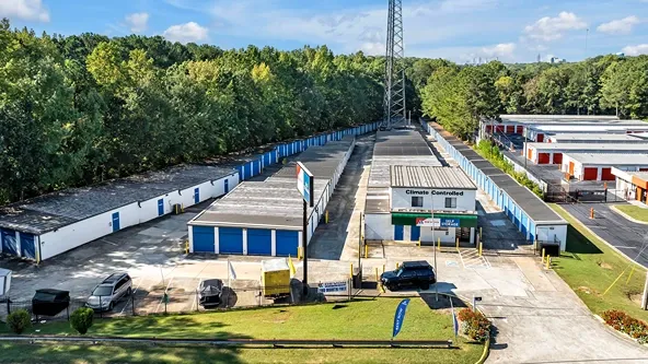 Aerial view of self storage facility with multiple rows of drive-up units and wide access lanes